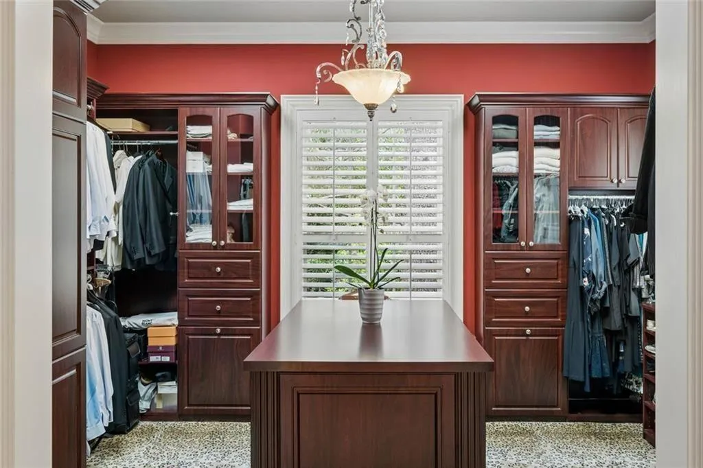 Separate shoe closet alongside the walk-in.