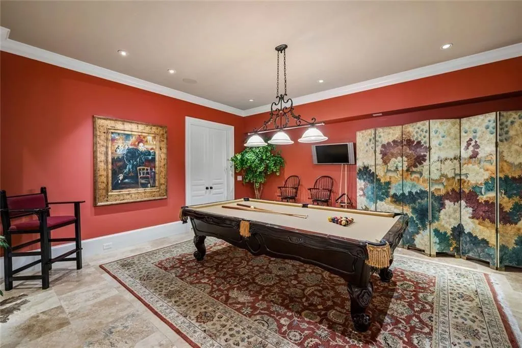 A bold, richly designed billiards room.