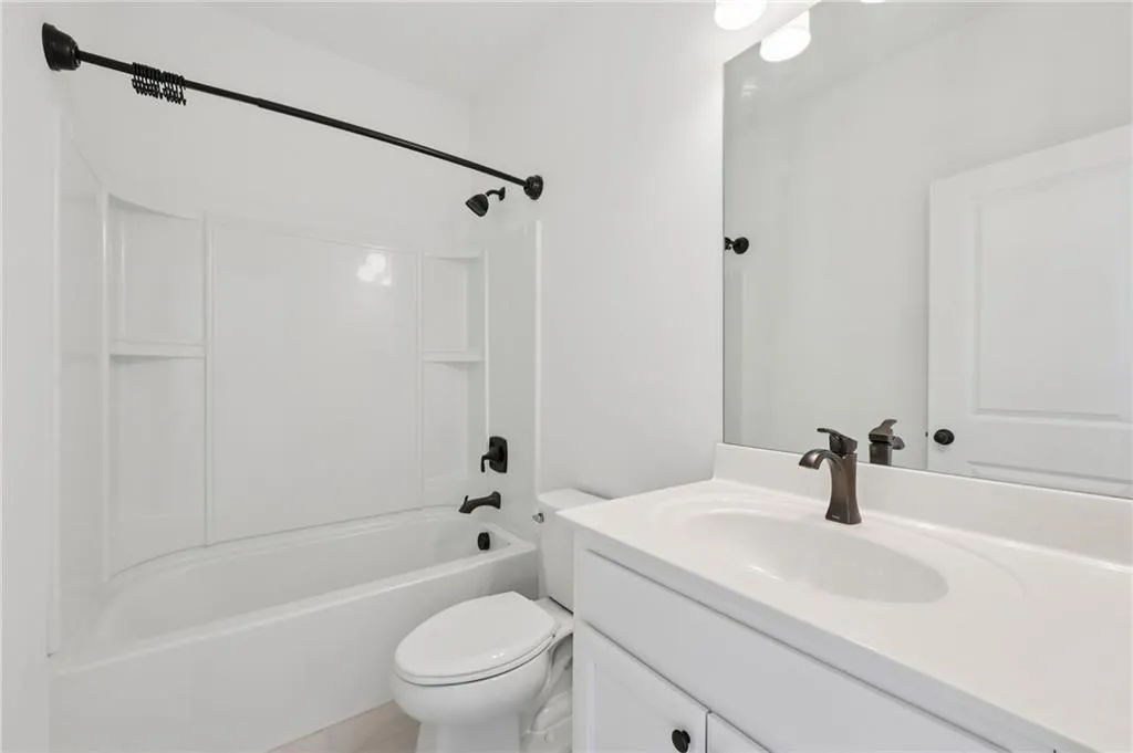 Full bathroom with vanity and  shower combination