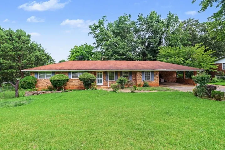 WELL MAINTAINED 4 SIDED BRICK RANCH WITH 2 CAR CARPORT!