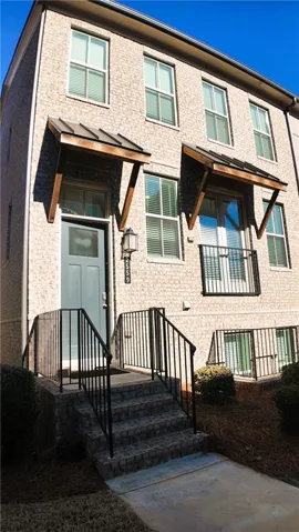 View of front of property with brick siding