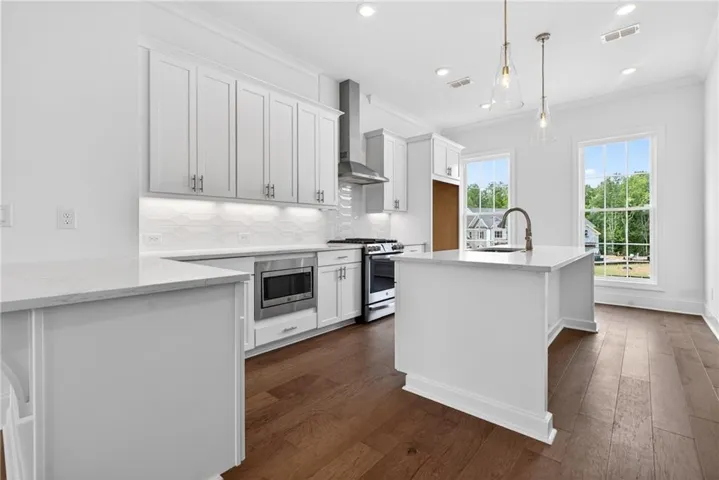 Wow, large kitchen - soft close doors and drawers through out the home, quartz kitchen countertop, single bowl sink, pendant lighting, tile backsplash, under cabinet lighting, WOW!