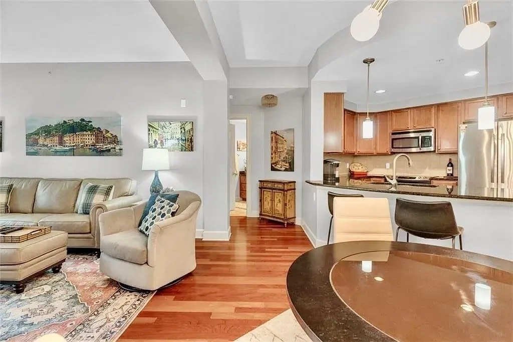Living area featuring light wood finished floors and recessed lighting