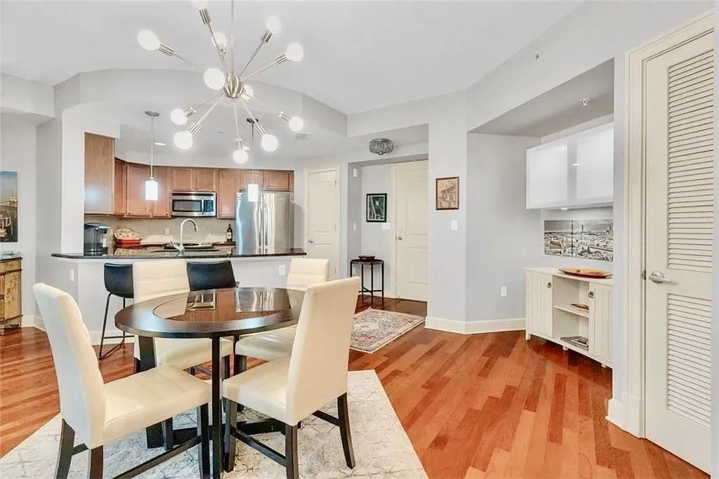 Dining space featuring light wood-style flooring and a chandelier