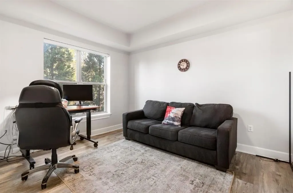 Home office featuring wood finished floors and baseboards
