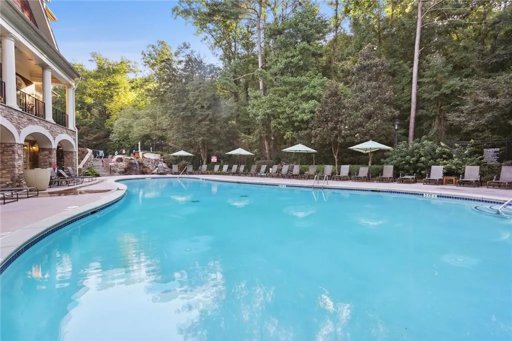 Community pool featuring a patio
