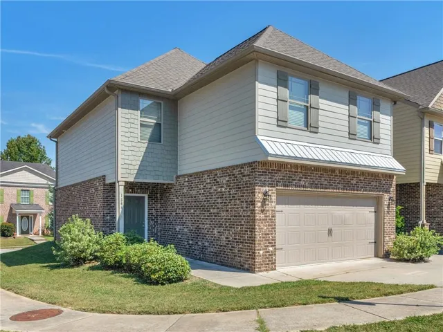 Brick and siding exterior with a two-car garage