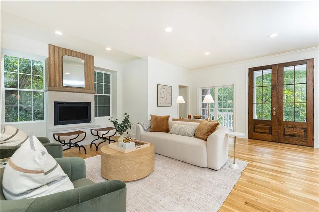 Natural light coming through multiple windows and glass  front door