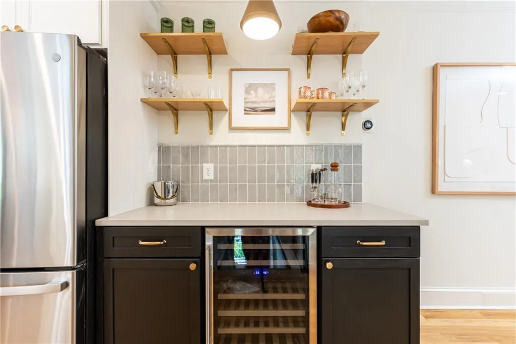 Bar has plenty of storage and a wine fridge