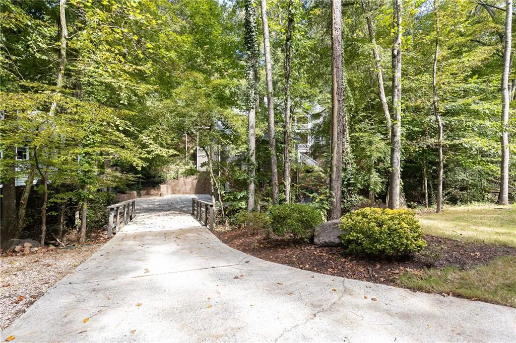Driveway entrance has bridge over creek