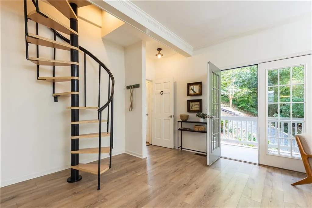 Spiral staircase leading to upper level