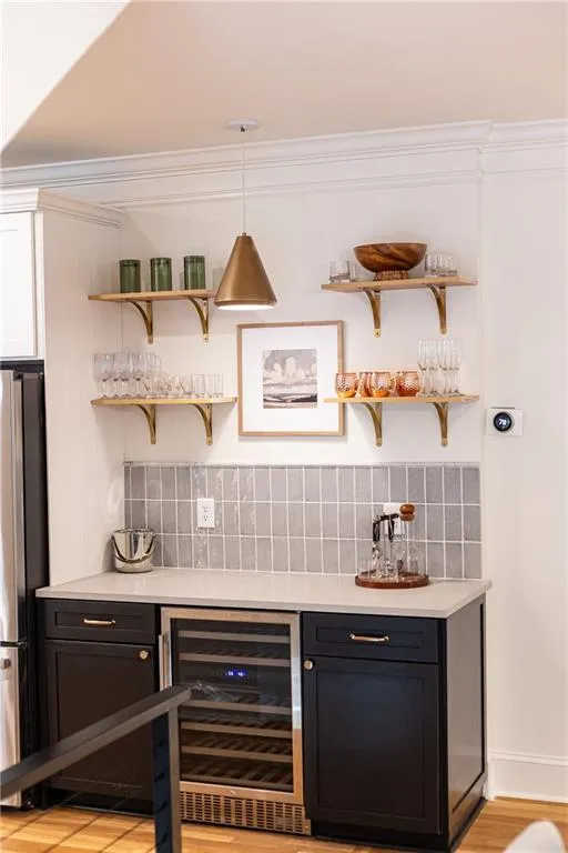 Updated Bar area with quarts countertops and handmade tile backsplash ... very on trend