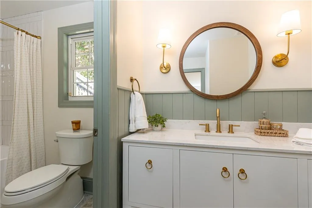 Upper level Bathroom 3 has large vanity are and a seperate room for tub/shower and toilet