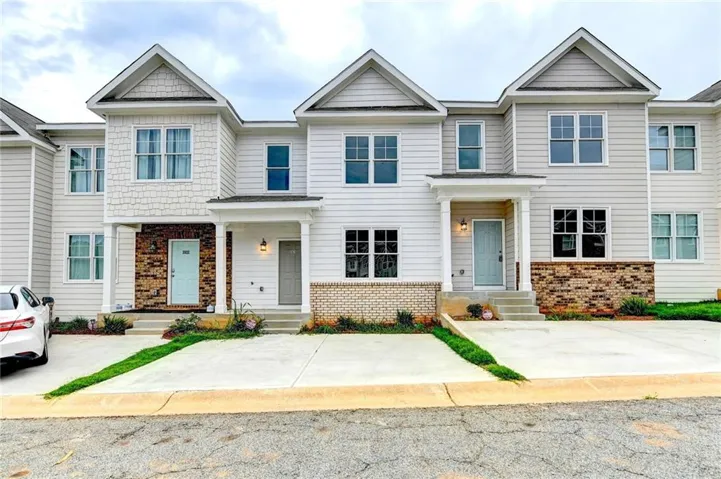 Craftsman-style home with brick siding