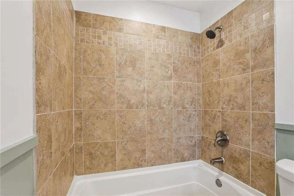 Bathroom with bathing tub / shower combination
