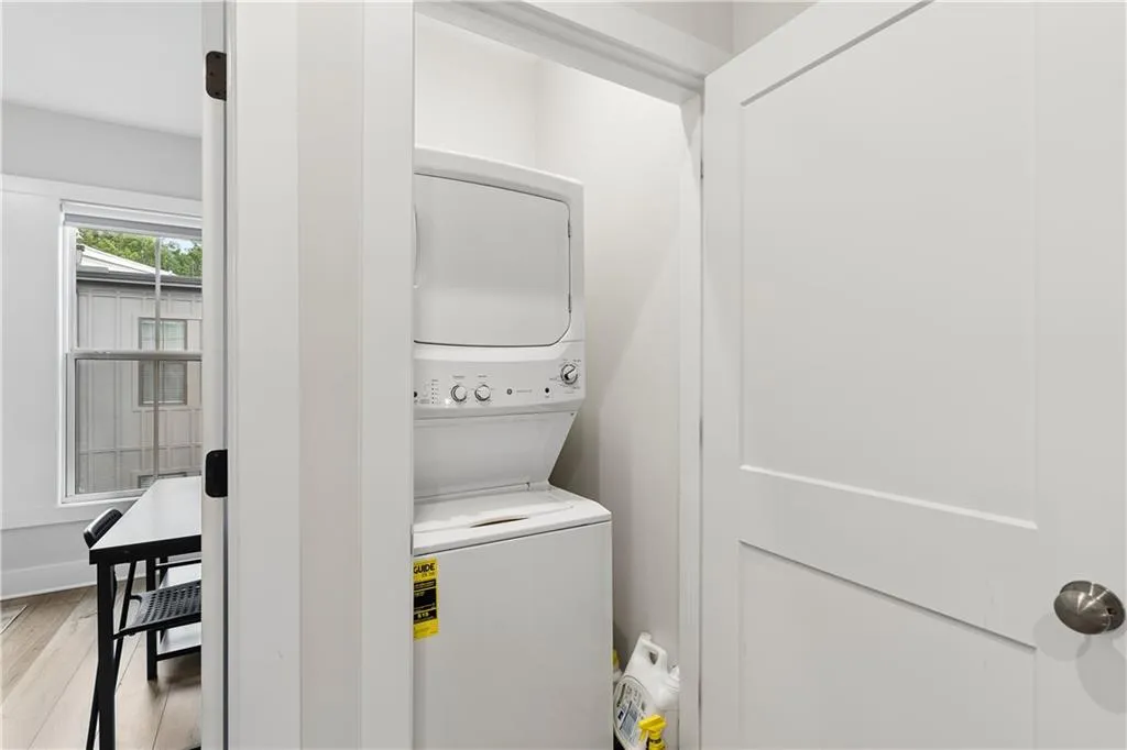 Dedicated laundry closet with stacked washer and dryer