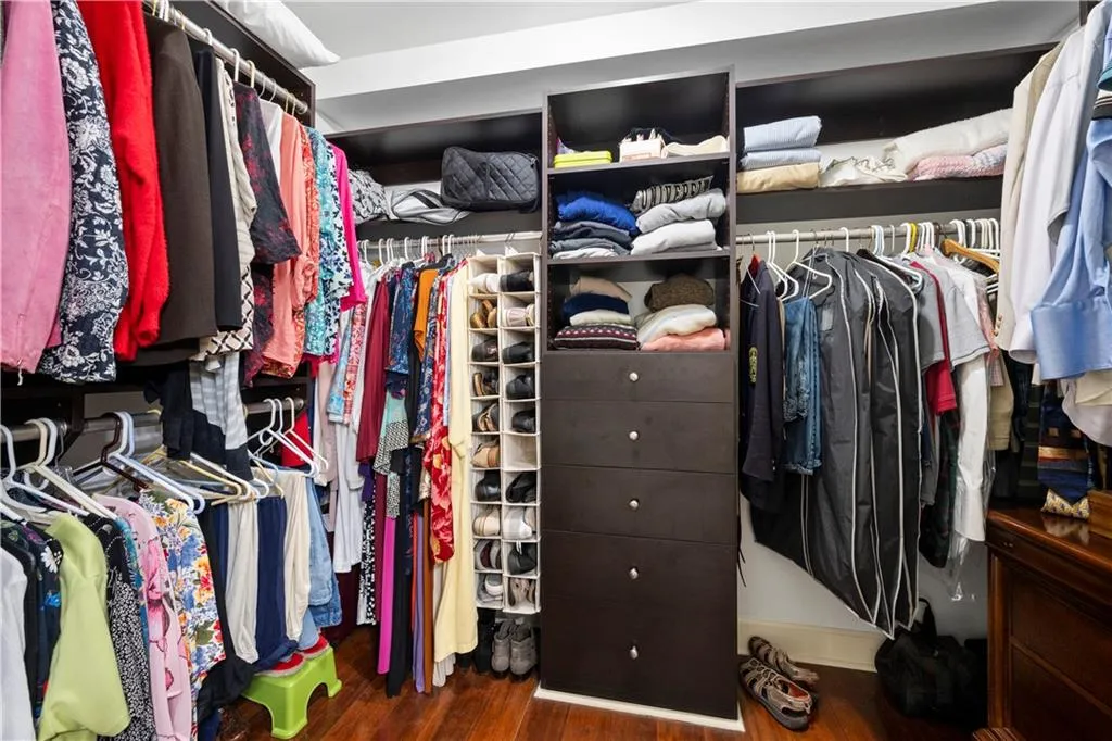 Spacious closet featuring wood finished floors