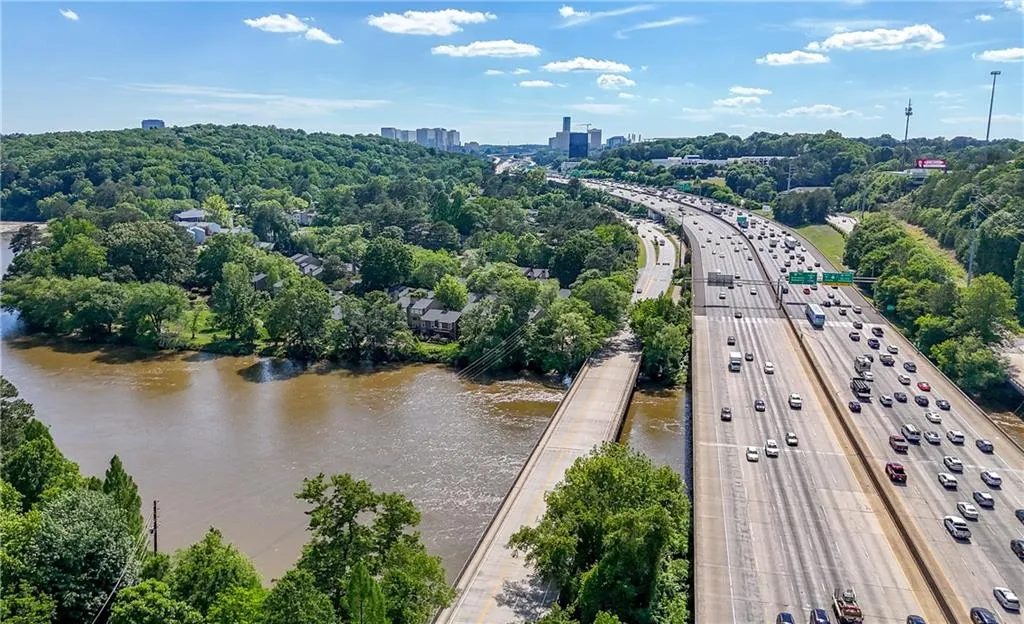 Aerial view of a highway and a large body of water