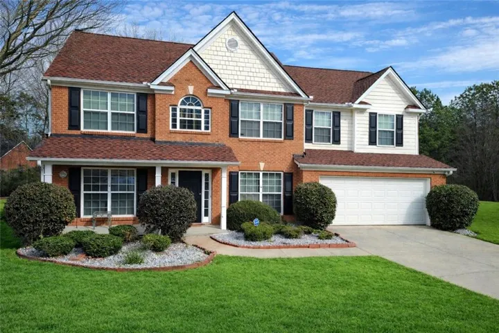 Brick and siding exterior with gabled roof lines