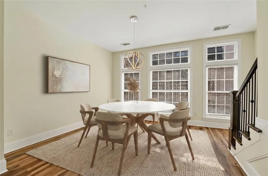 Dining area with wood finished floors and baseboards