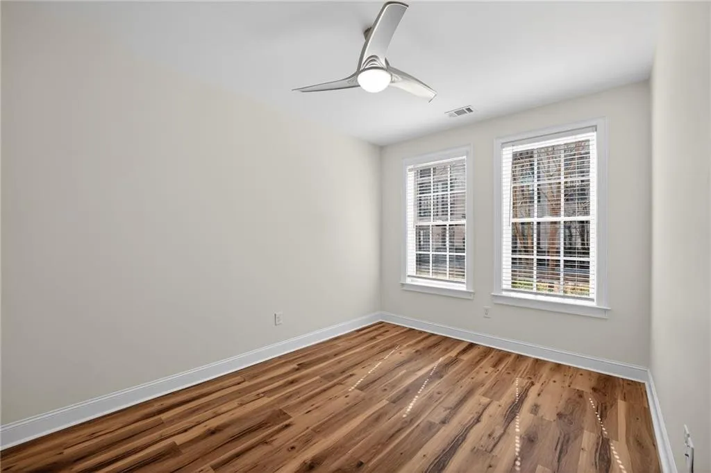 Spare room featuring ceiling fan and wood finished floors