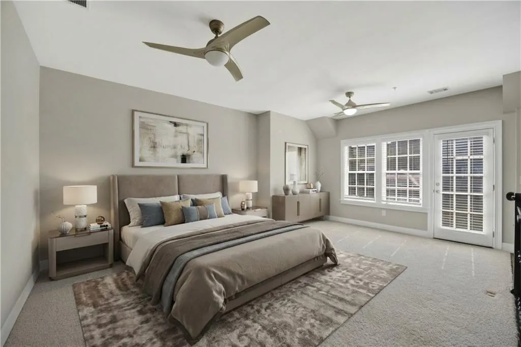 Bedroom with access to outside, carpet, and ceiling fan