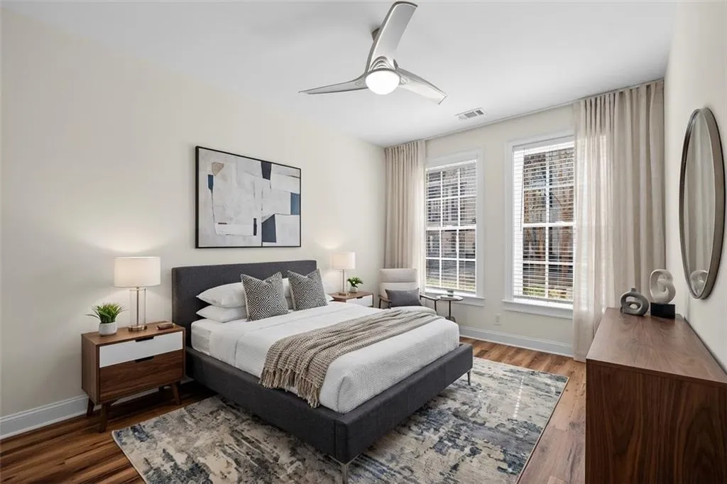 Bedroom featuring wood finished floors and ceiling fan