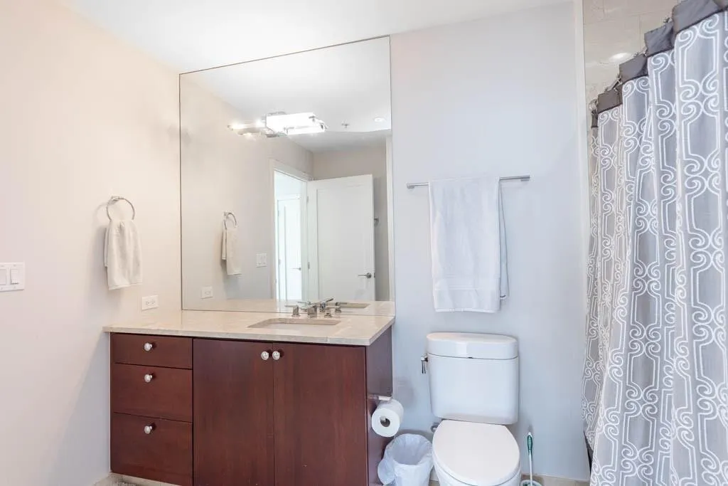 Bathroom with vanity and curtained shower