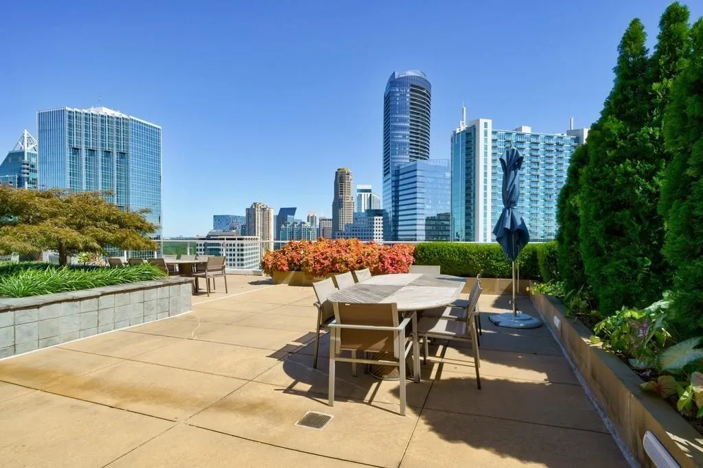 View of patio / terrace with outdoor dining area and a skyline view