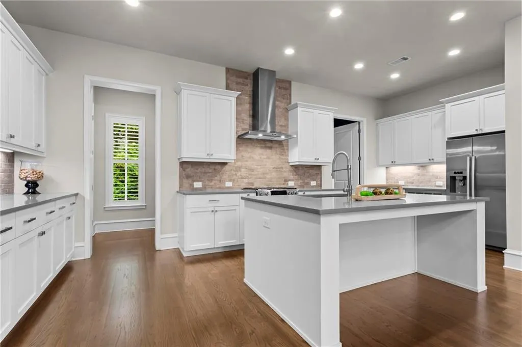 Open concept, custom BELL cabinetry, quartz countertops