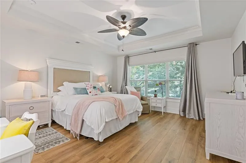 Oversized owner's suite also has new LVP flooring and overlooks a private backyard