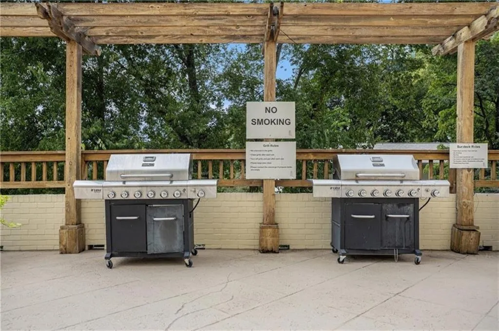 View of patio featuring a pergola and a grill