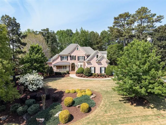 Gorgeous curb appeal on this estate home in prestigious Sugarloaf Country Club.