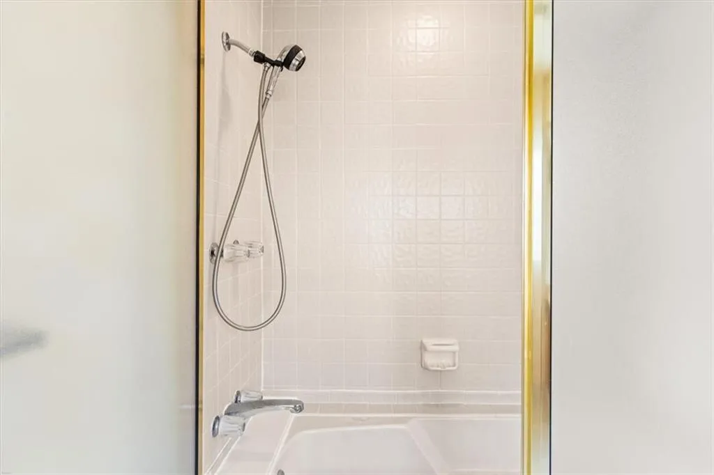 Full bath featuring shower / tub combination