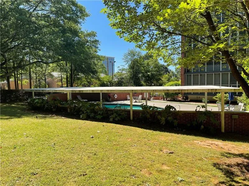 View of yard with a fenced in pool
