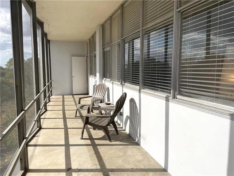 View of screened porch which runs full lentgh of unit