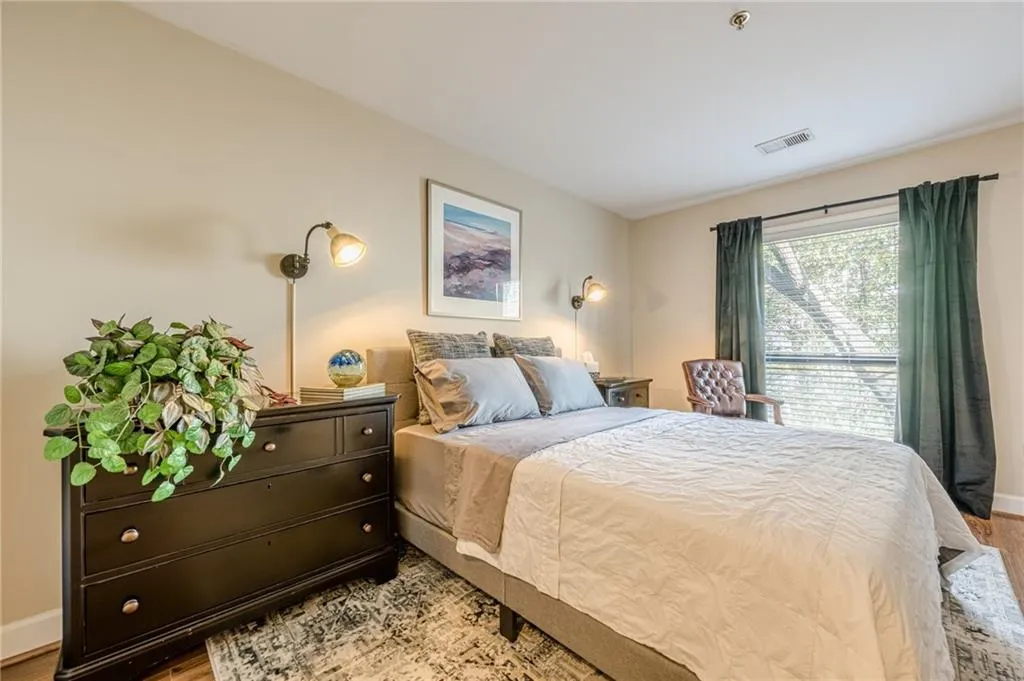 Bedroom featuring light wood-type flooring and baseboards