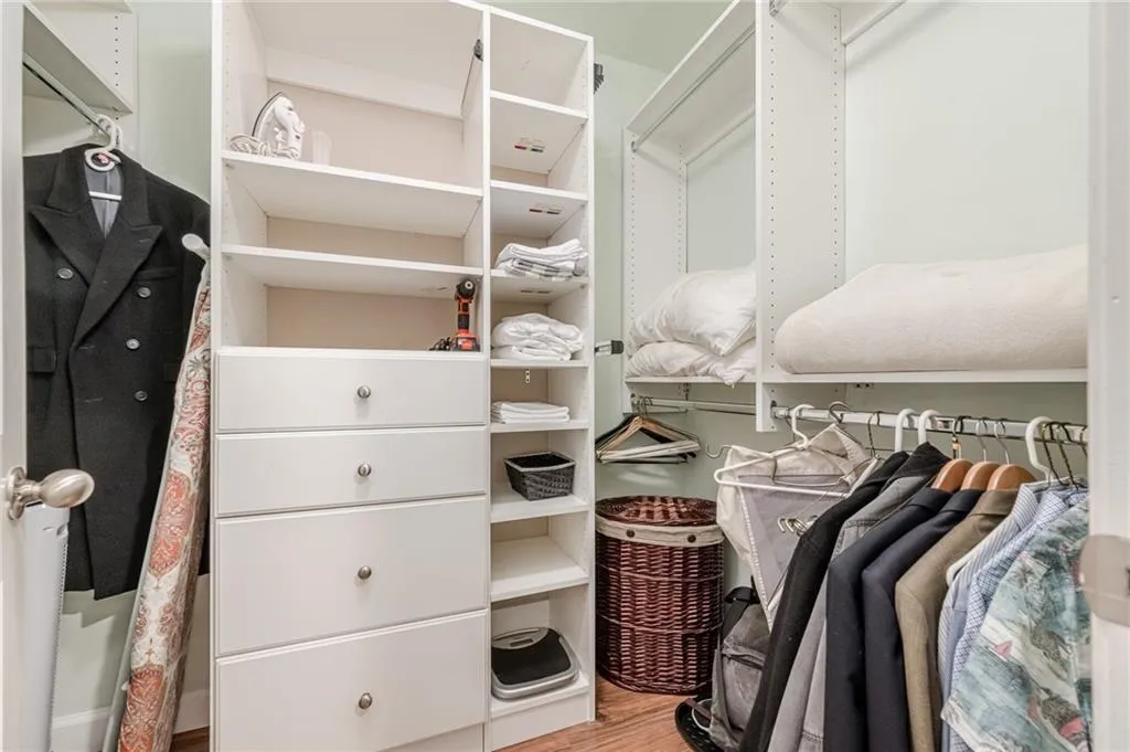 Spacious closet featuring wood finished floors