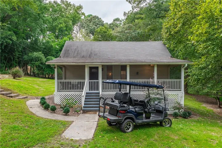 Covered front porch with white lattice detailing