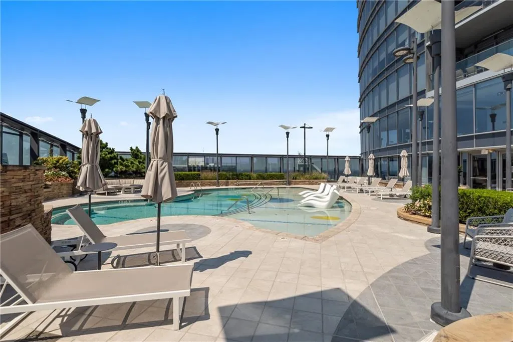 Community pool featuring a patio