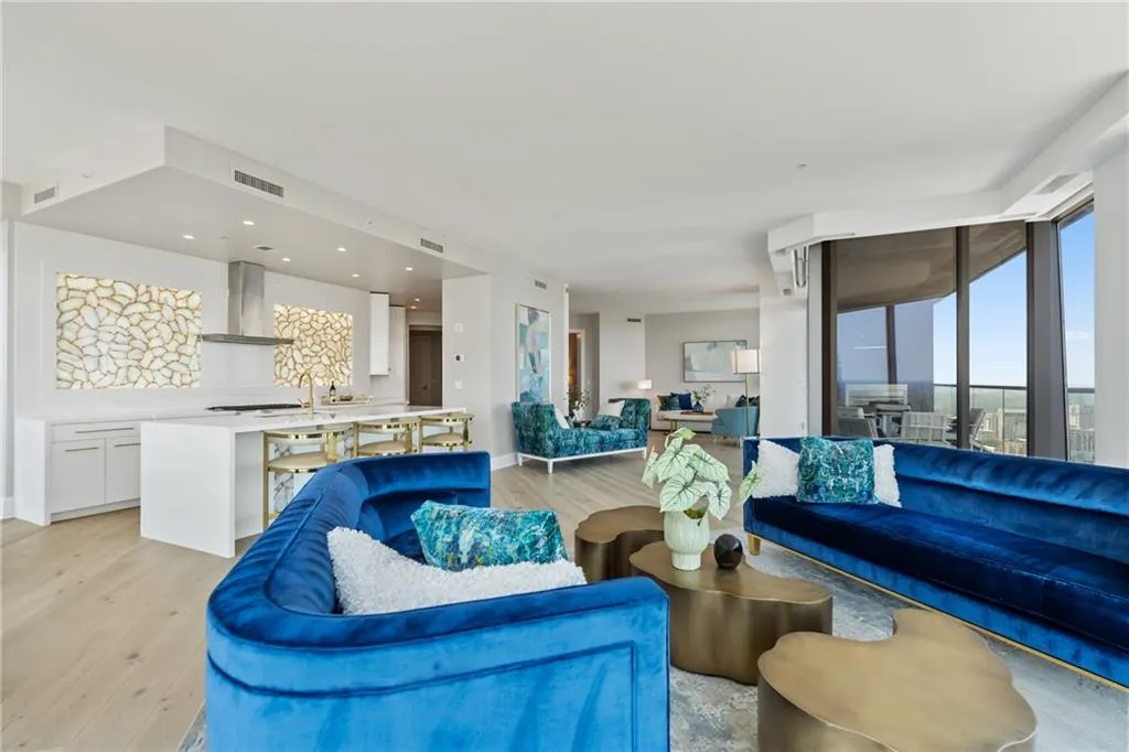 Living area with light wood finished floors and baseboards