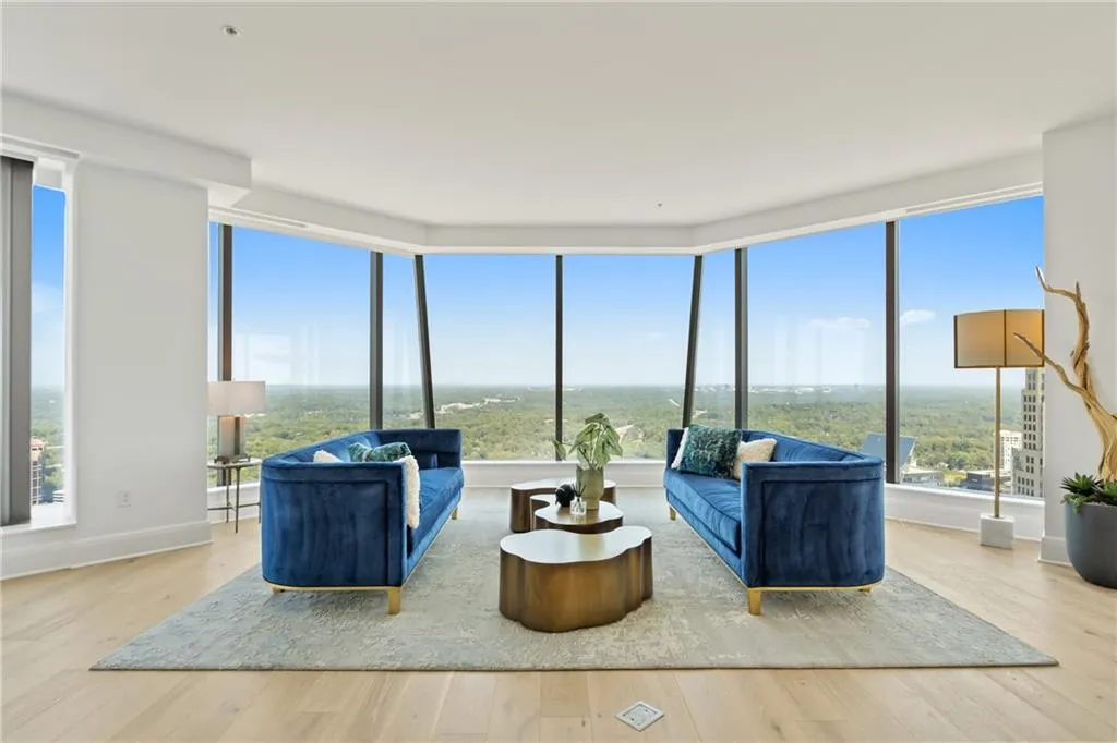 Living area with light wood-type flooring and baseboards