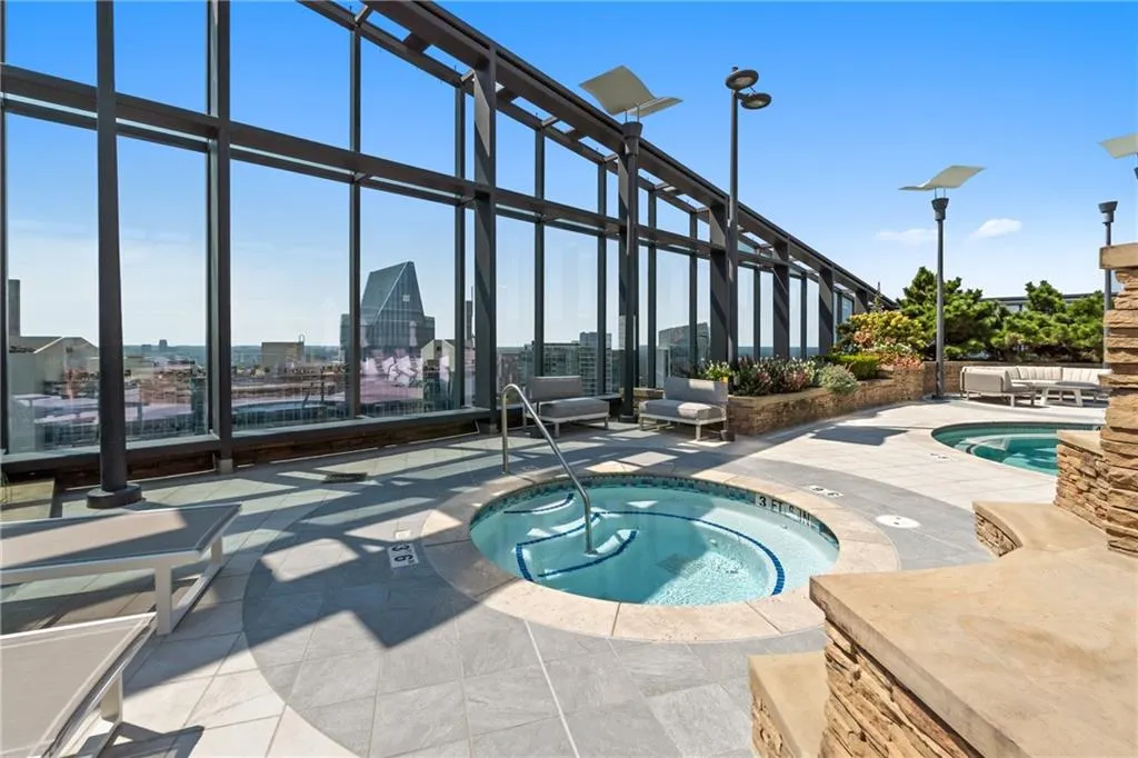 Outdoor pool with a community hot tub
