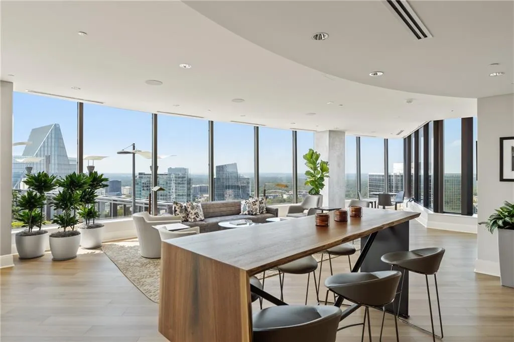 Kitchen with a view of city, light wood-style floors, expansive windows, and recessed lighting