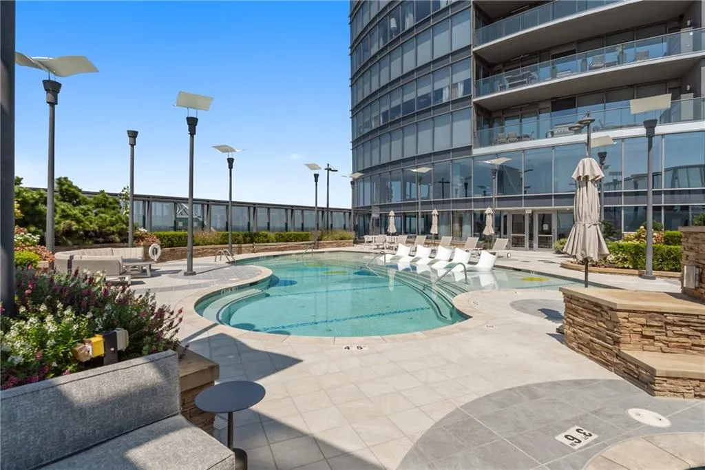 Community pool with a patio area