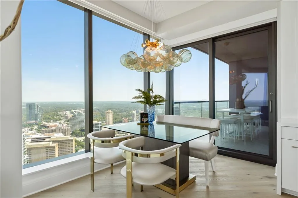 Dining room with light wood-style floors and a view of city