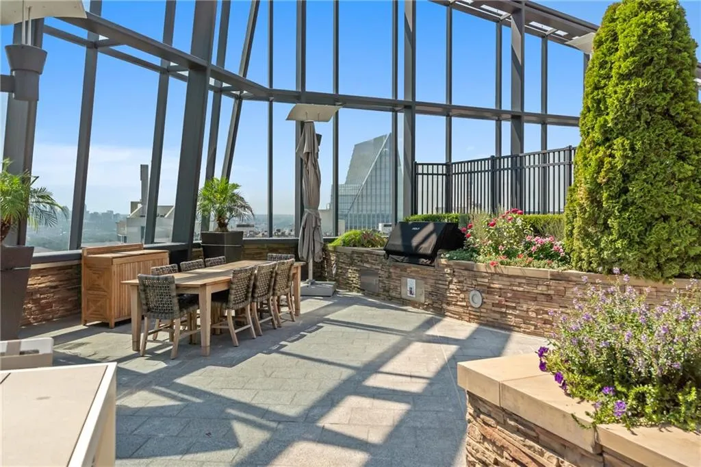 View of patio featuring outdoor dining area and area for grilling
