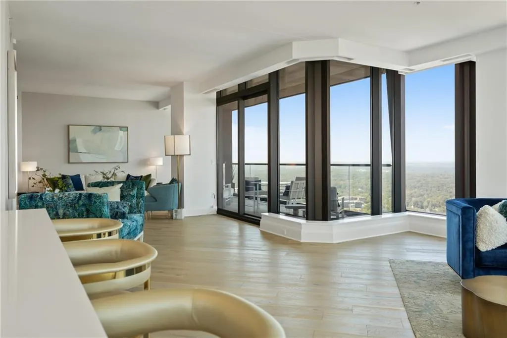 Living room with light wood-style floors and baseboards