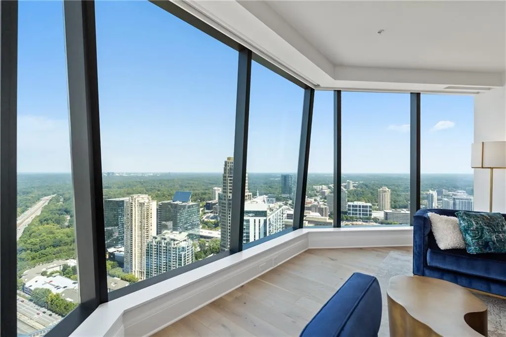Living area featuring wood finished floors and a view of city