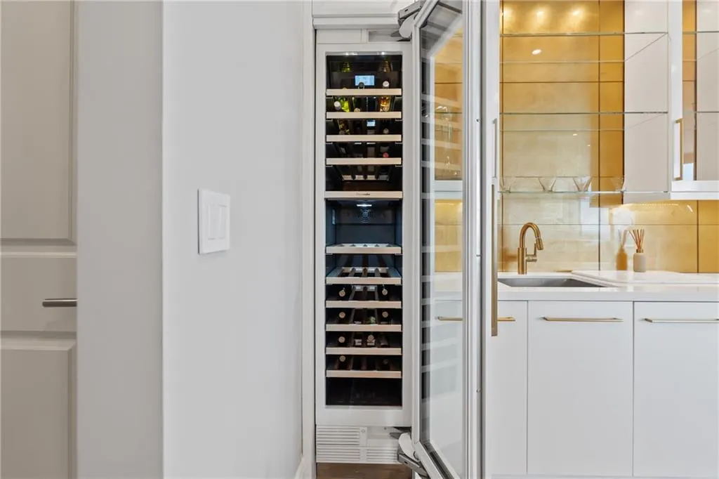 Utility room featuring a sink and beverage cooler
